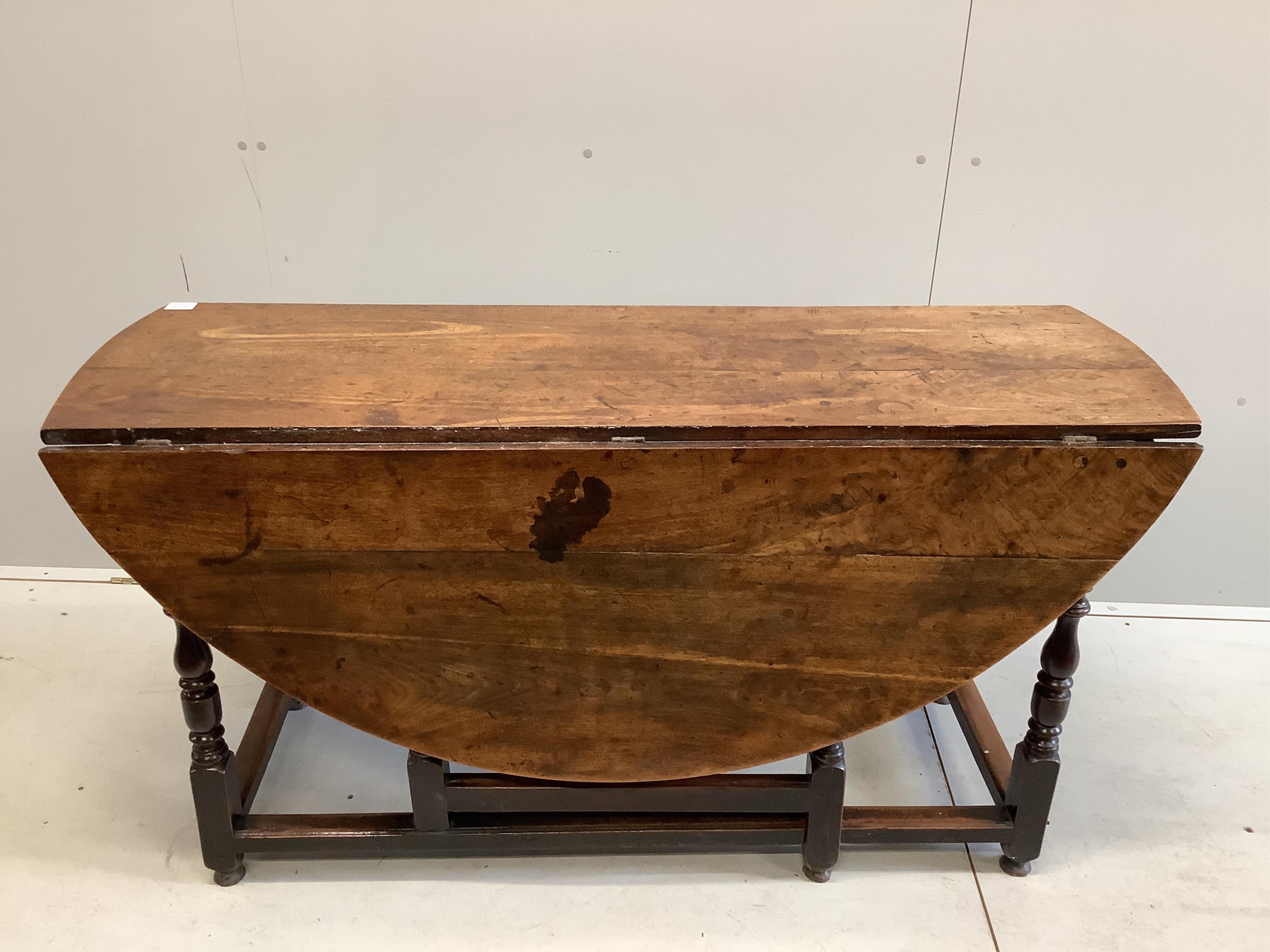 An 18th century mahogany gateleg dining table, 145cm extended, depth 144cm, height 74cm. Condition - fair to good